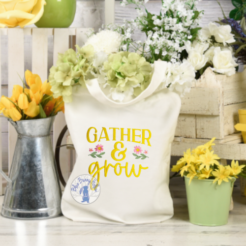 Gather and Grow embroidery design with flowers stitched on tote bag.