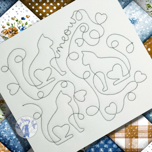 e2e heart kitties quilting design stitched on quilt fabric.