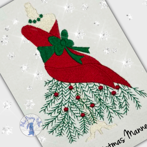 Evergreen boughs and holly berries detail beneath the mannequin in the 2025 Christmas Mannequin embroidery design. (Copy)