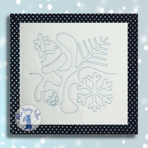 Snowing E2E quilting design with hat and snowflake.