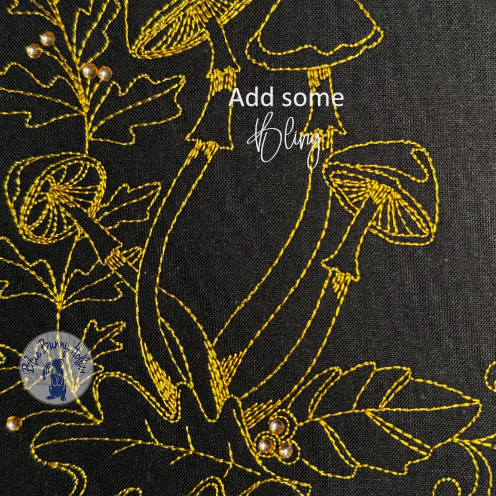 Mushroom in the Woods redwork-style embroidery design surrounded by detailed forest vegetation with added crystals.