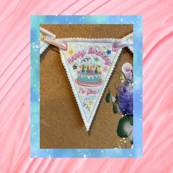 Reusable Happy Birthday bunting, pennant one of three, machine embroidery design stitched in the hoop on felt, featuring a birthday cake, gifts, pastel stitching, pinked edges.