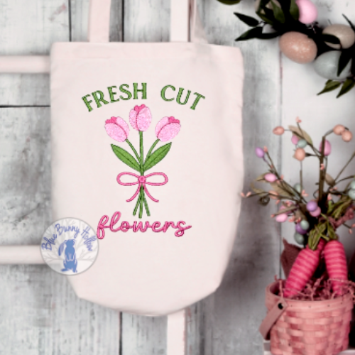 Close-up of Fresh Cut Flowers embroidery lettering and stitching.