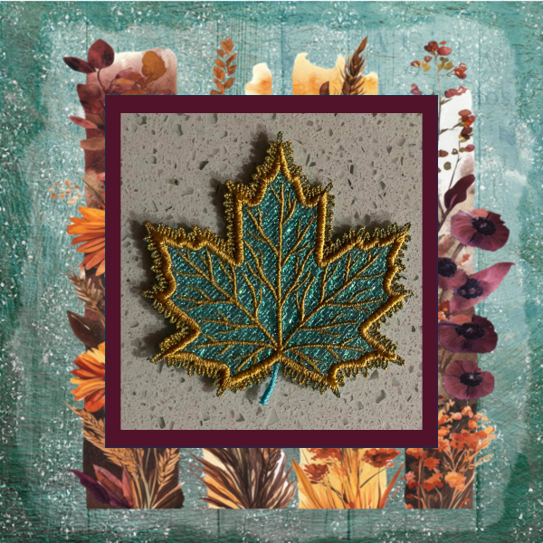 Turquoise and gold lace maple leaf machine embroidery design with shimmering Mylar applique and tatted loop border.