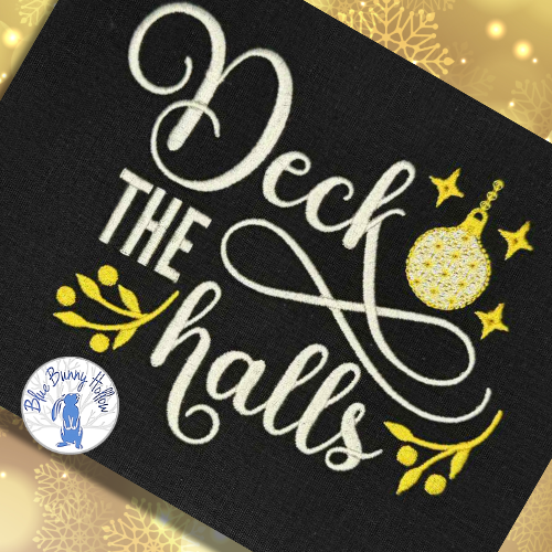 Christmas ornament embroidery with cream script lettering.