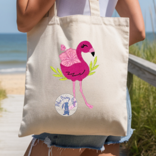 Cute flamingo embroidery design with hibiscus flower.