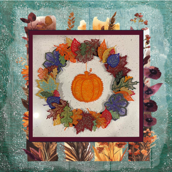 11 colorful Mylar applique autumn leaves stitched in the hoop, arranged as a decorative fall wreath with pumpkin..