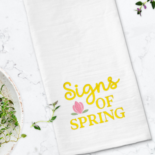 Spring embroidery design with floral detail and lettering.