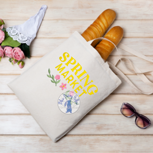 Spring Market embroidery design with flowers on tote bag.