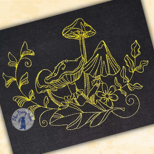 Fairy-tale mushroom machine embroidery surrounded by woodland leaves and forest vegetation.