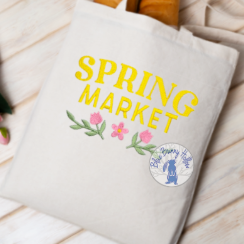 Close-up of Spring Market embroidery stitching.