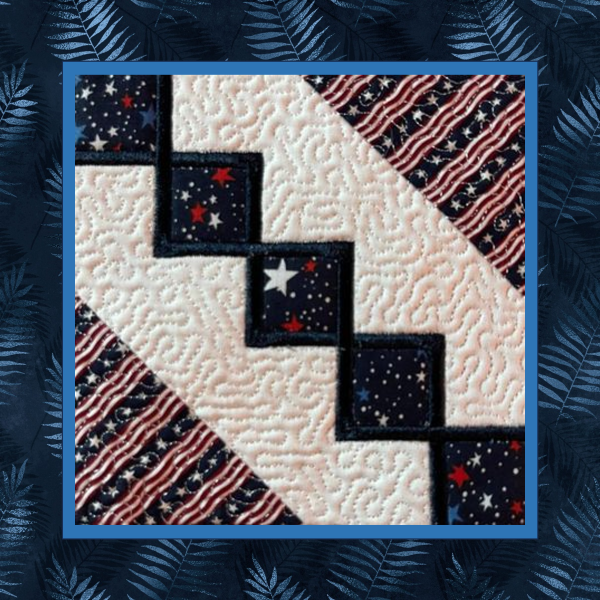 Patriotic 6-inch in-the-hoop quilt block featuring a diagonal chain of navy diamond appliques with star fabrics and striped patriotic corner sections, machine embroidered and stipple quilted.