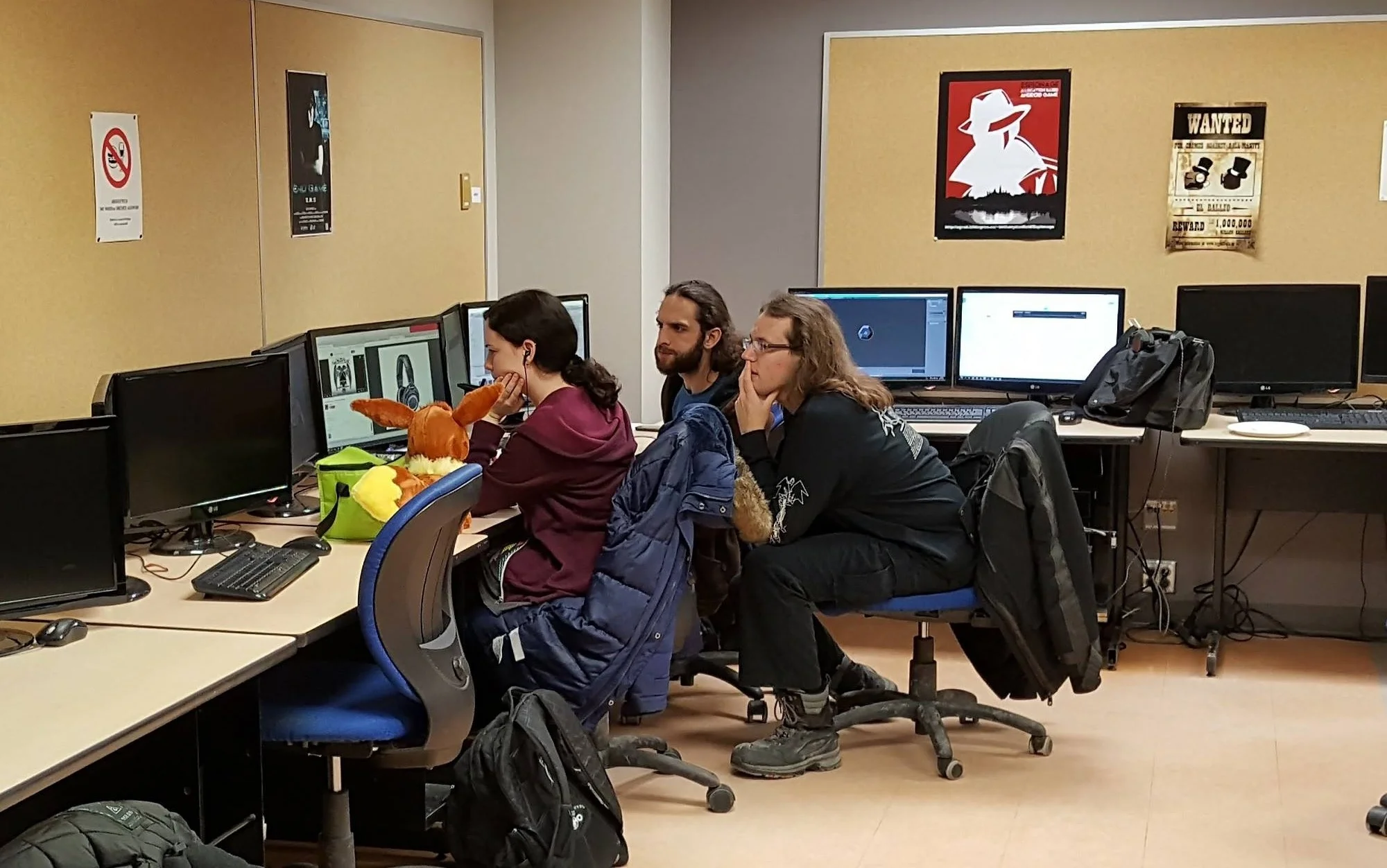 Photo taken by event host Ali Arya. Here I’m showing two of my team members my modeling work for the headset stage while discussing more ideas for the game.