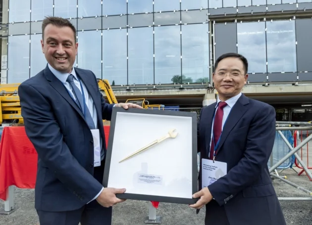 From left, Adam Knaggs Director, of SDC, presents Jiwu Wang, chairman of Tus-Holdings, with a commermorative spanner. Picture: Keith Heppell