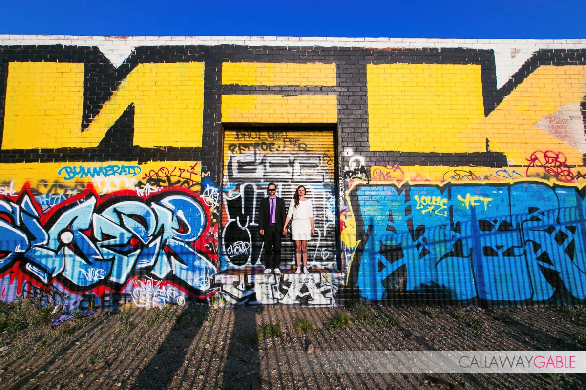 cool street art engagement photo in downtown los angeles