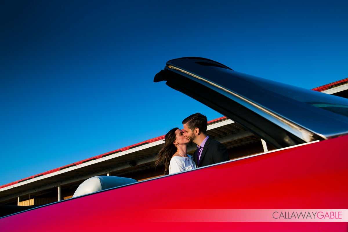 Downtown Los Angeles Engagement Photo with red car and a dog