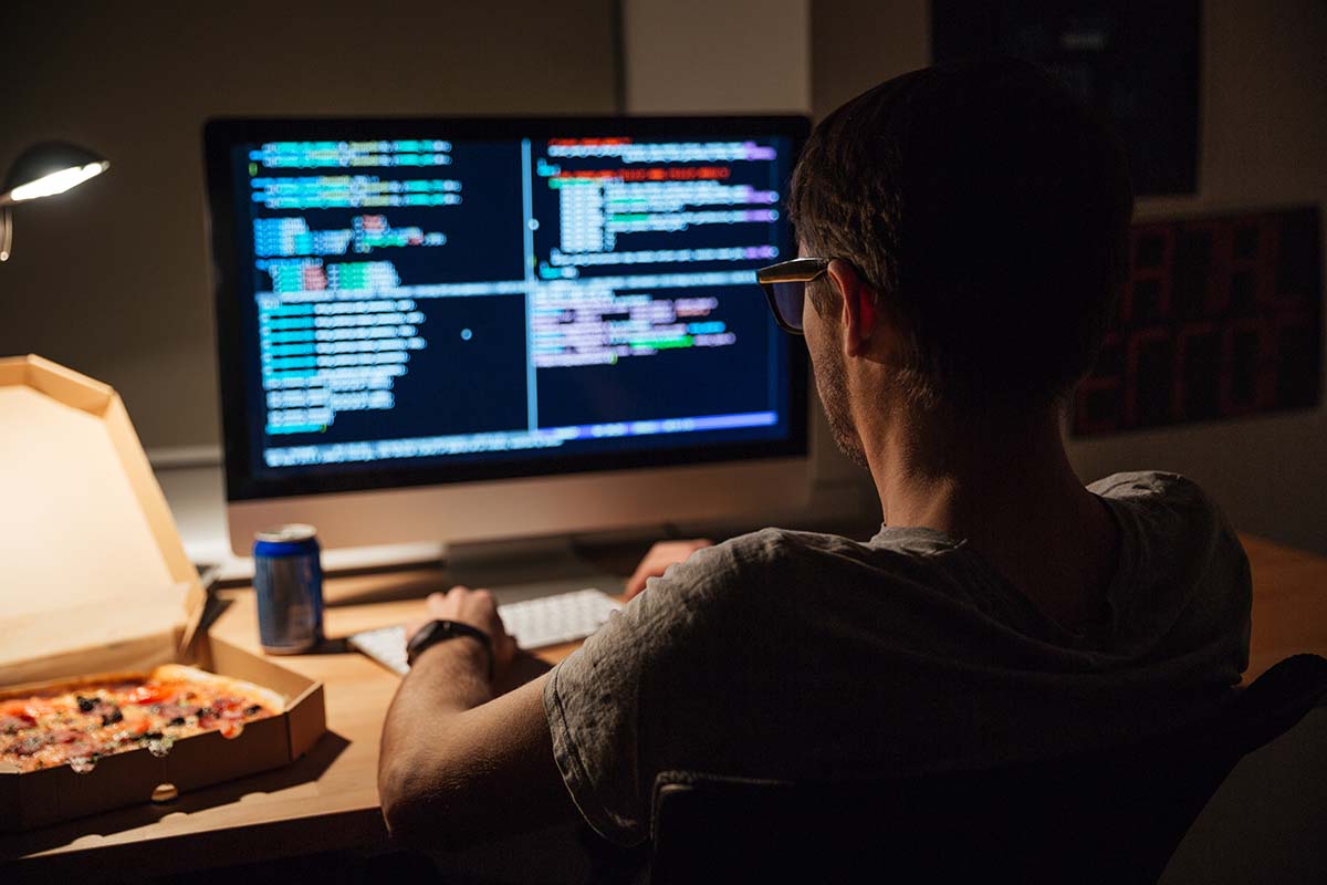 focused-programmer-writing-code-eating.jpg