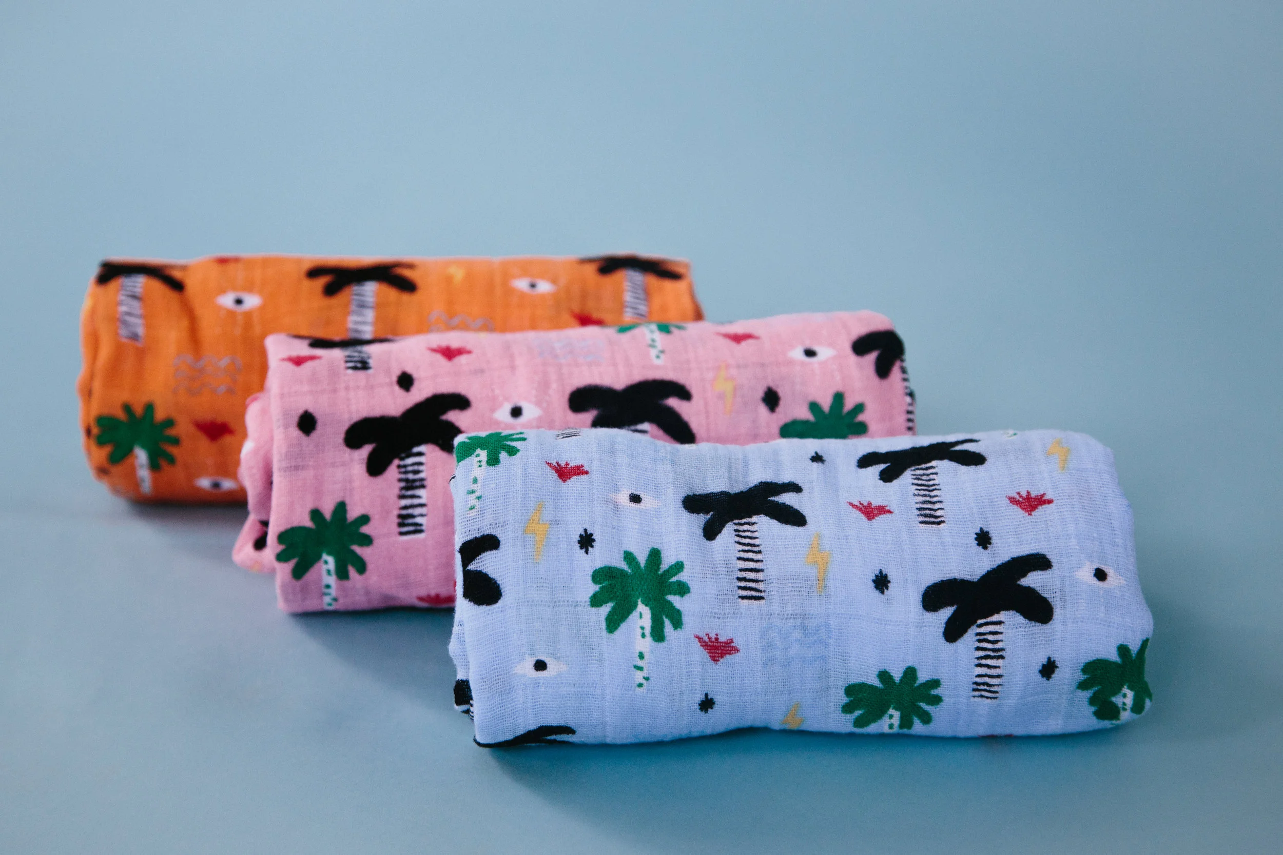 Palm Eye Swaddles (orange, pink, blue)