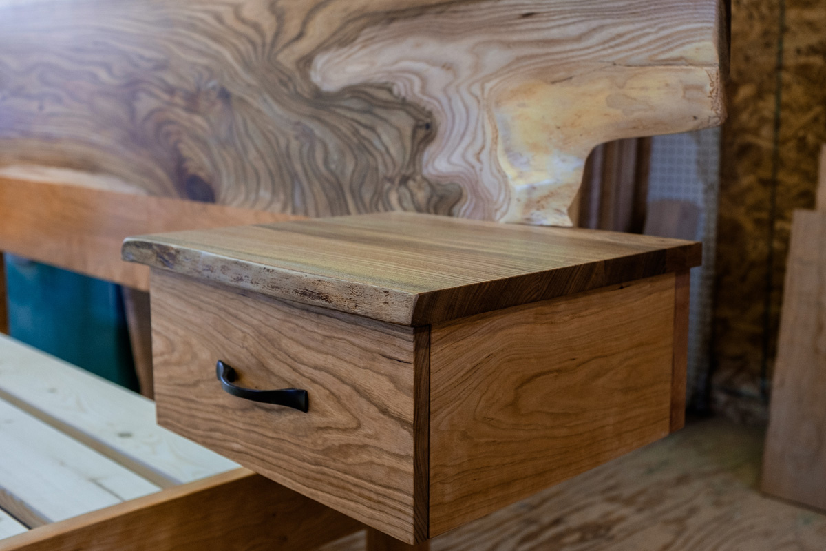 Night stand cubby detail with elm top, the boxes are detachable from the headboard for easier transport.