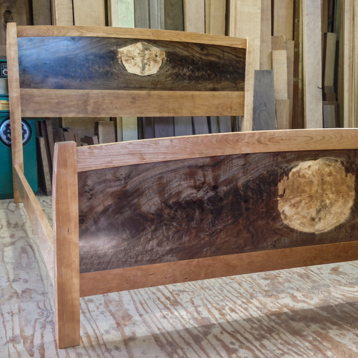 Claro walnut bookmatched headboard and footboard panels with a cherry bedframe.