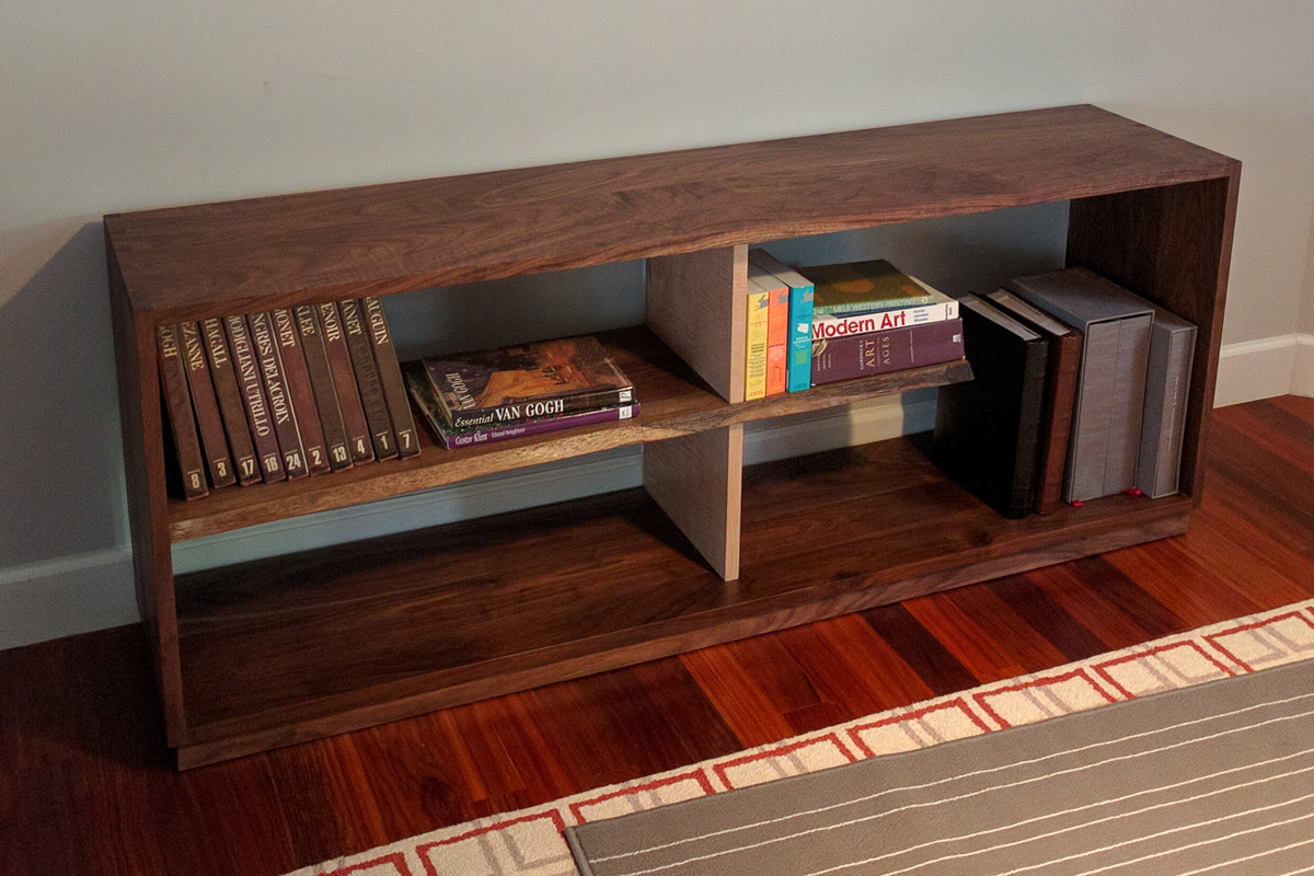 Dovetail walnut case with a live edge shelf and curly maple divider.