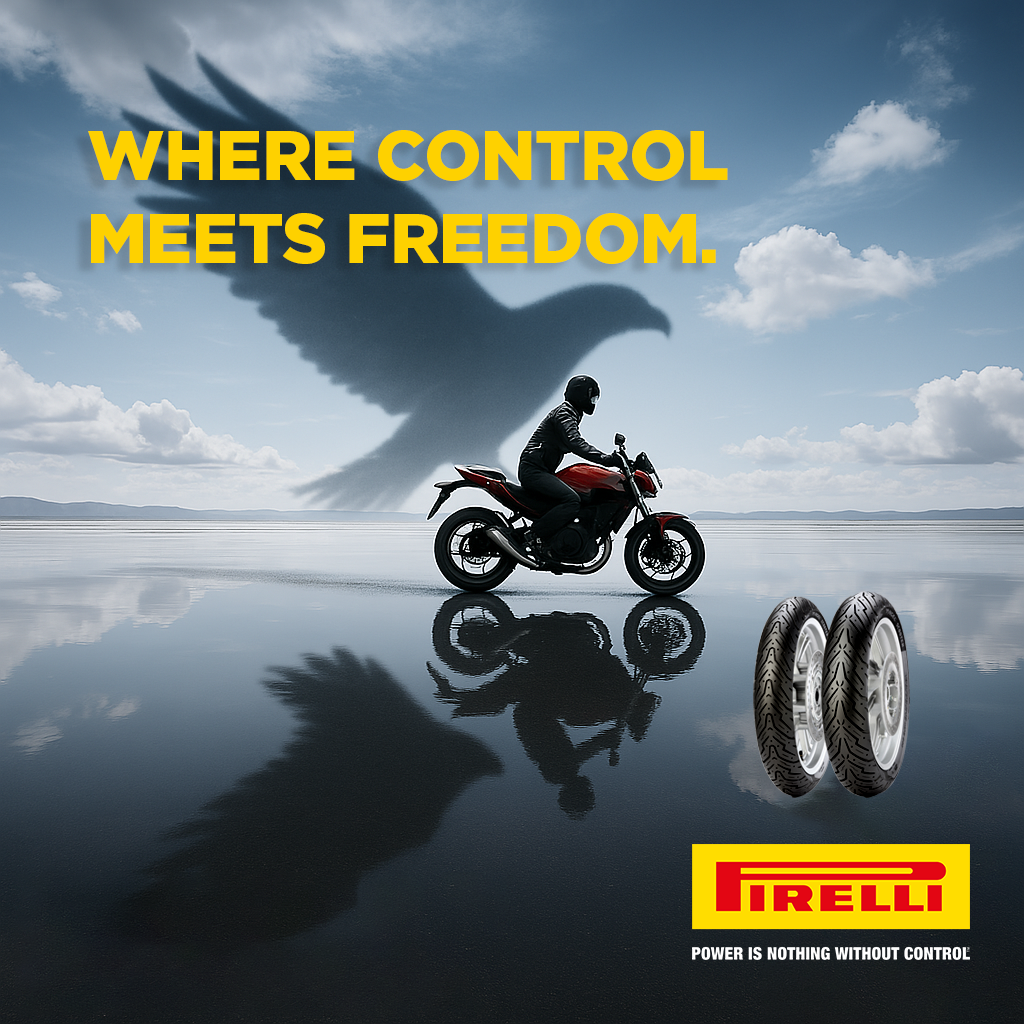 A motorcyclist riding on a reflective wet surface with a large bird-shaped shadow in the sky and two tires in the foreground. Text reads "WHERE CONTROL MEETS FREEDOM." Pirelli logo and slogan "POWER IS NOTHING WITHOUT CONTROL."