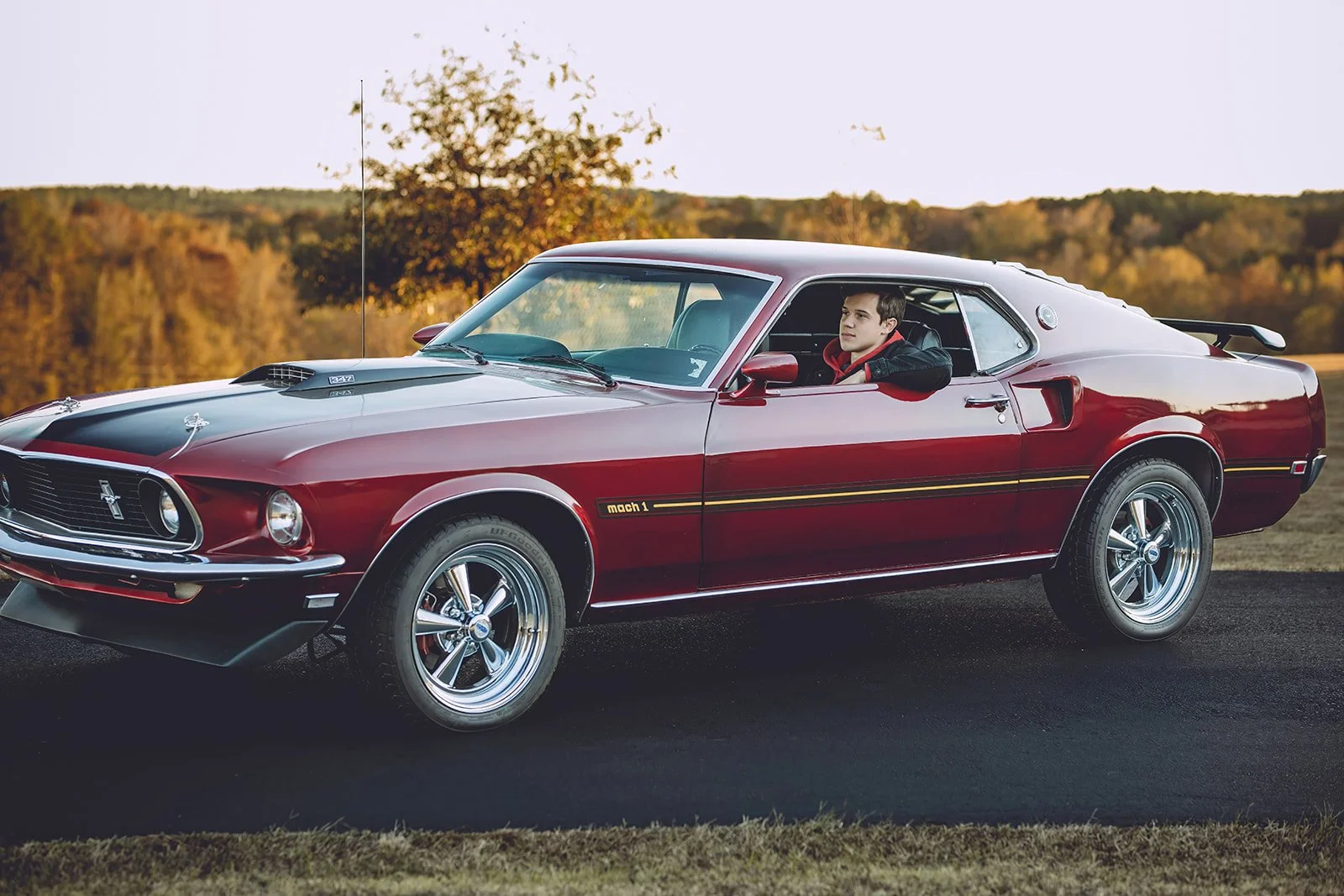 senior picture with guy in vintage car