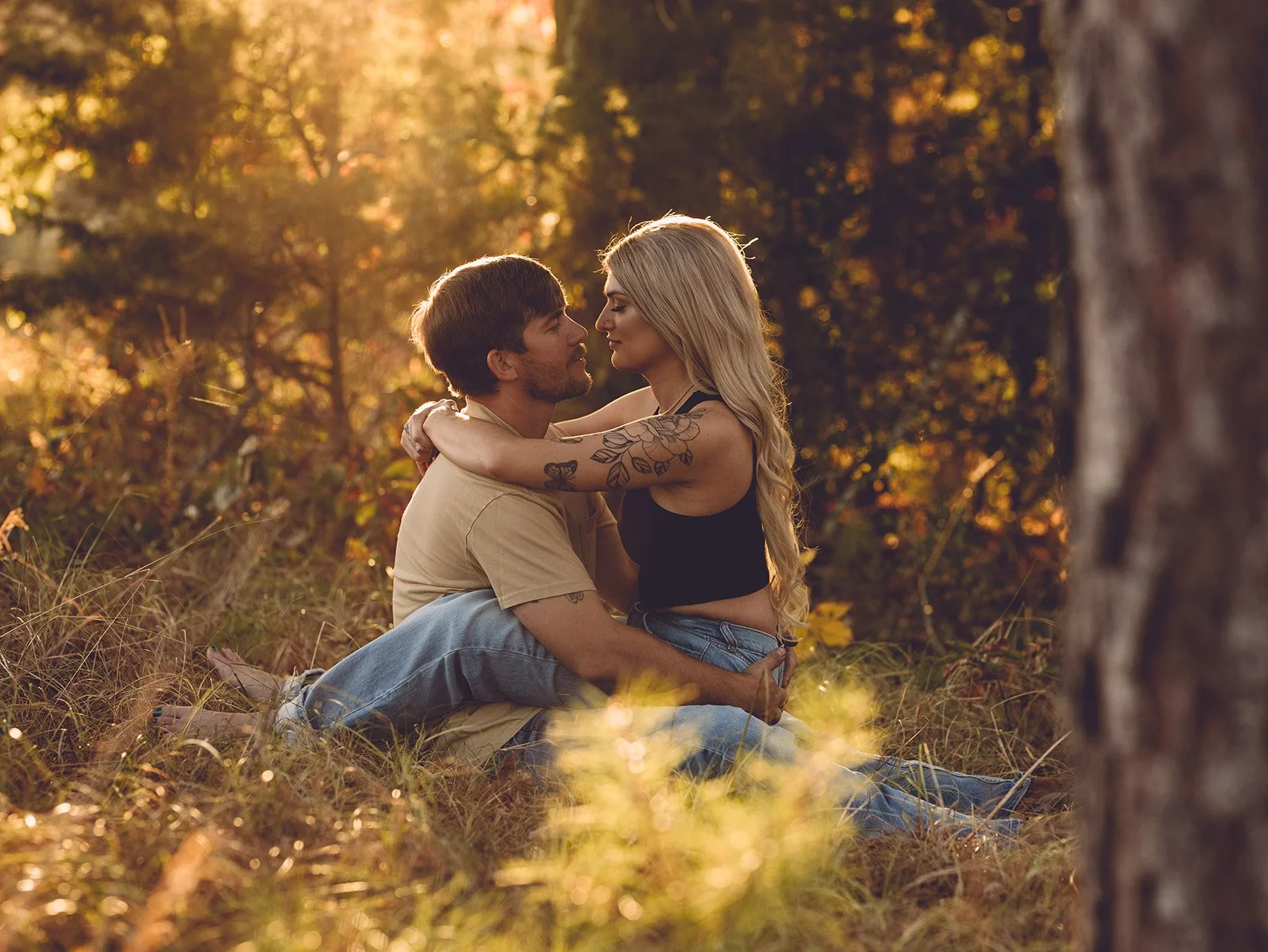 engagement photo with female sitting on fiance's lap