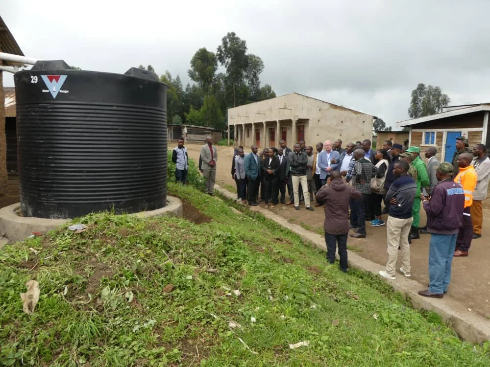 Participants at the launch checking out one of the newly installed rain water harvesting tanks.