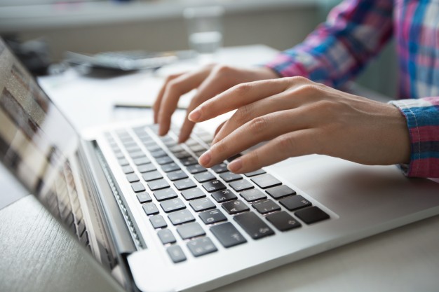 cropped-view-of-hands-typing-on-laptop_1262-3196.jpg