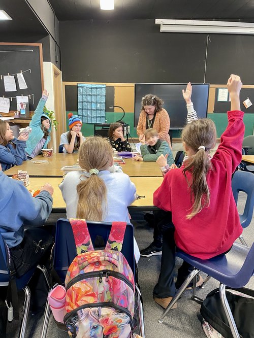 Middle school students engaged in class