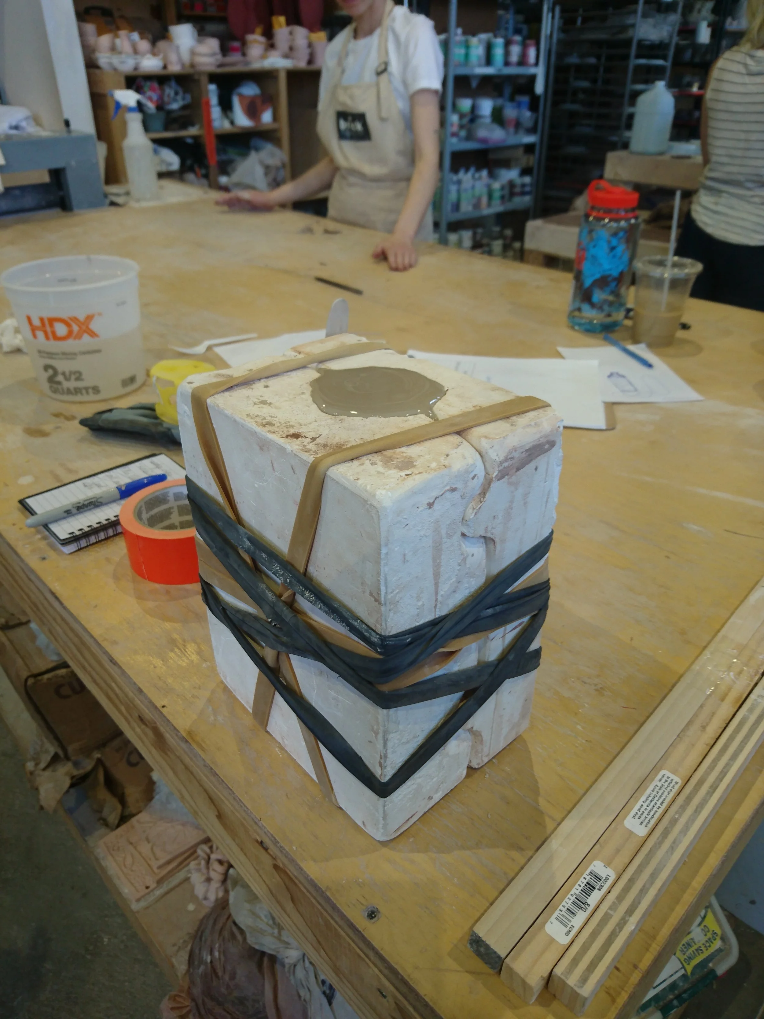 Filling the bottle mould with slip