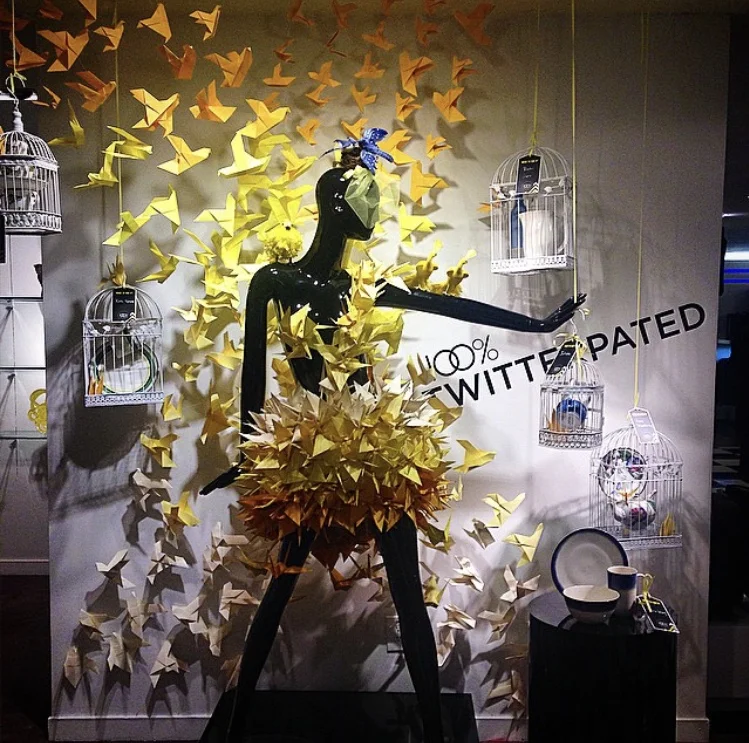 A dress and wall décor made entirely of origami birds