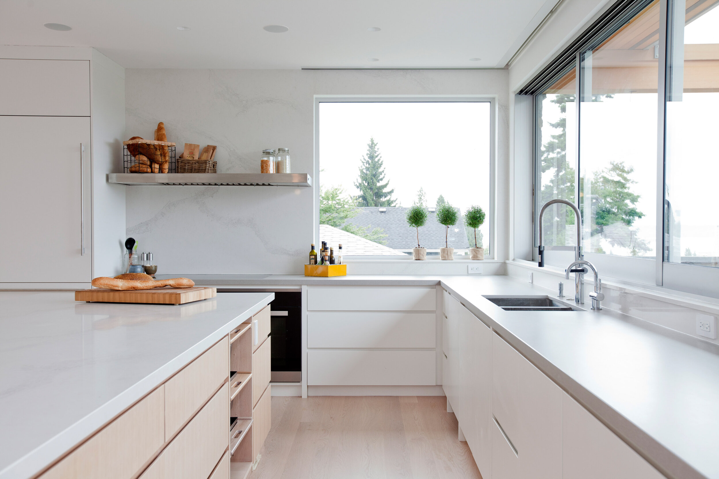 Jamie Banfield Design, interior design, vancouver, kitchen, cabients, white, wood flooring, large windows, panel ready frdige, island.jpg