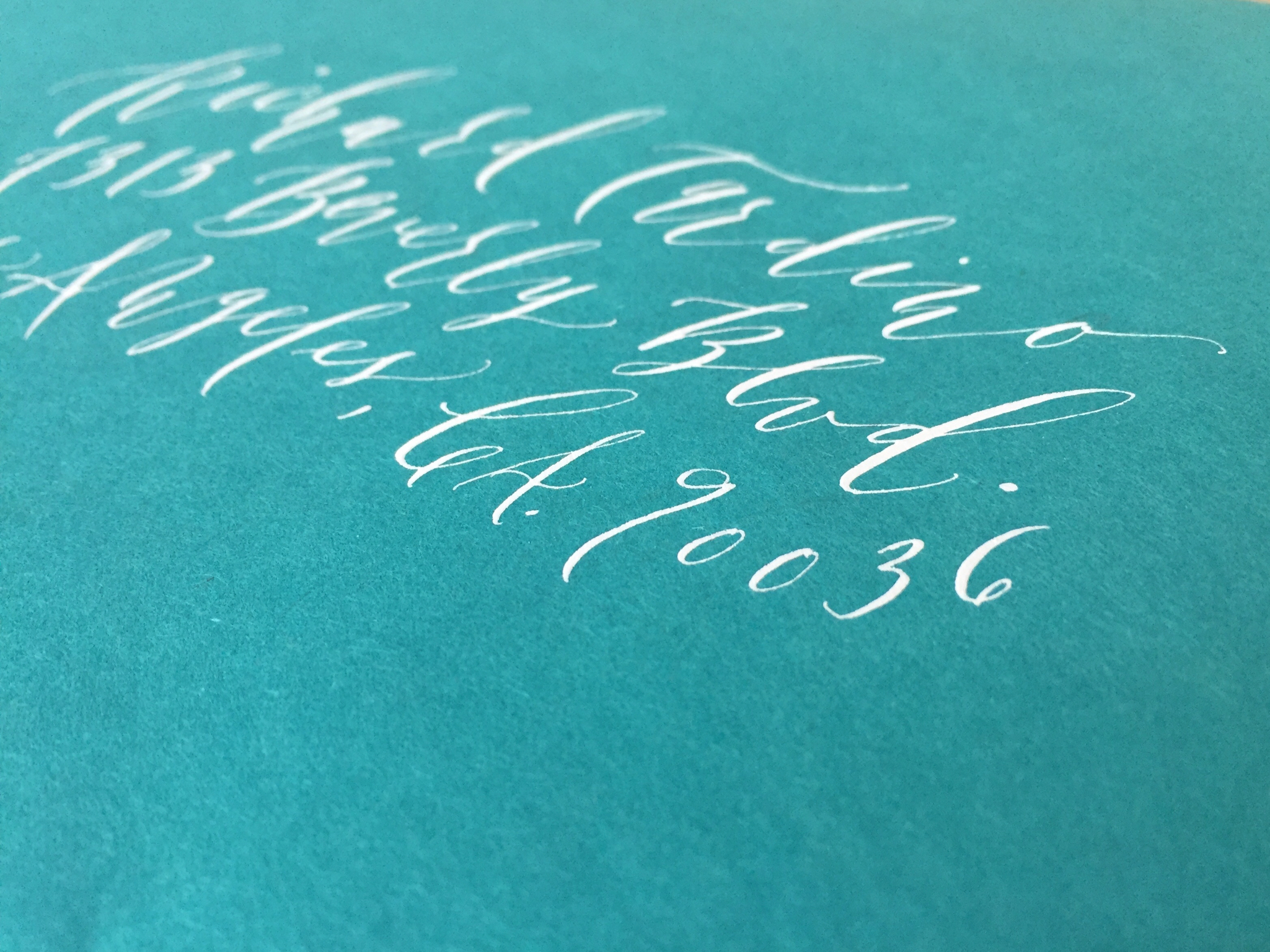 tigerfloss-white-ink-blue-envelope-calligraphy-side-view.jpg