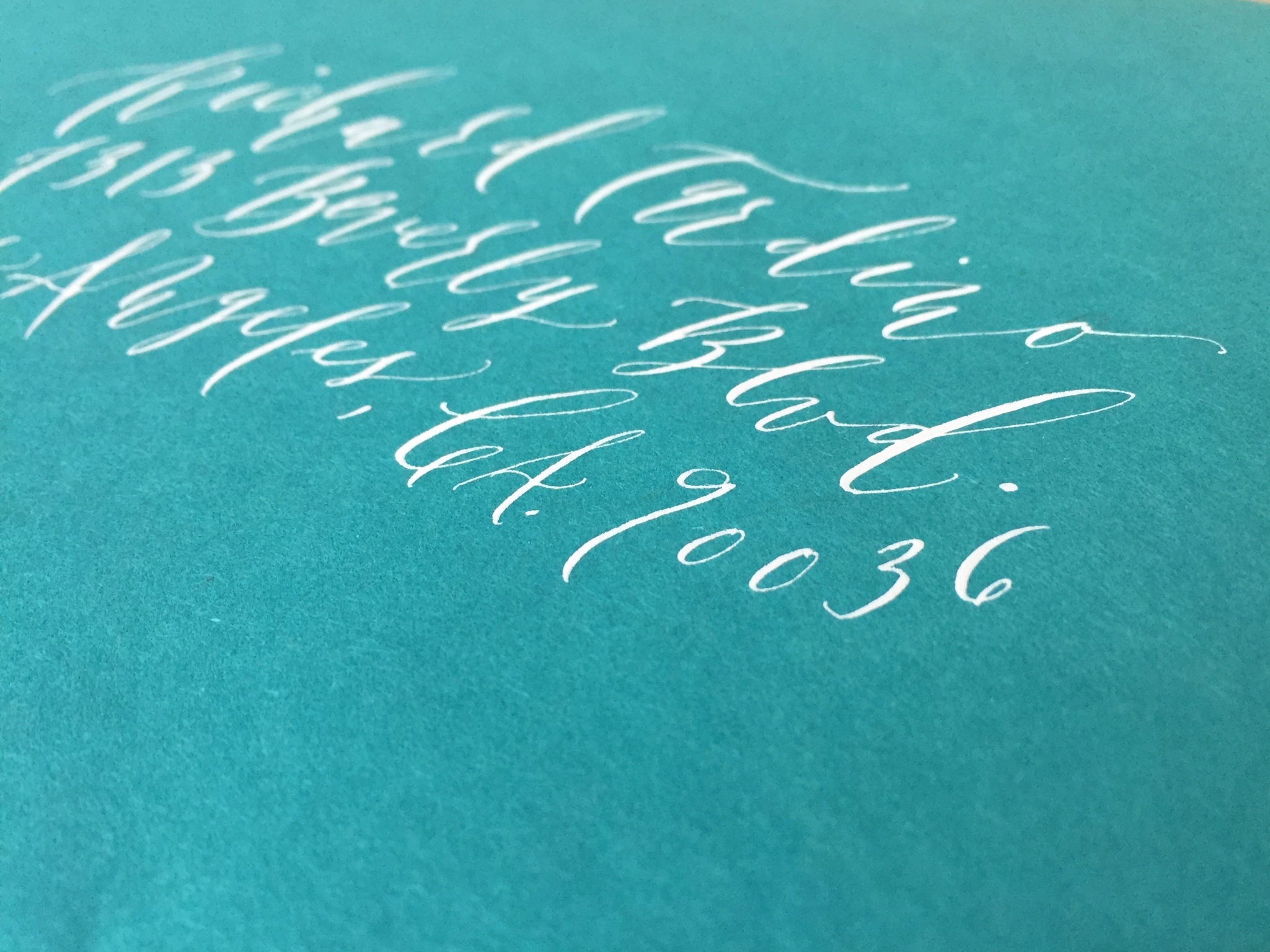 tigerfloss-white-ink-blue-envelope-calligraphy-side-view.jpg
