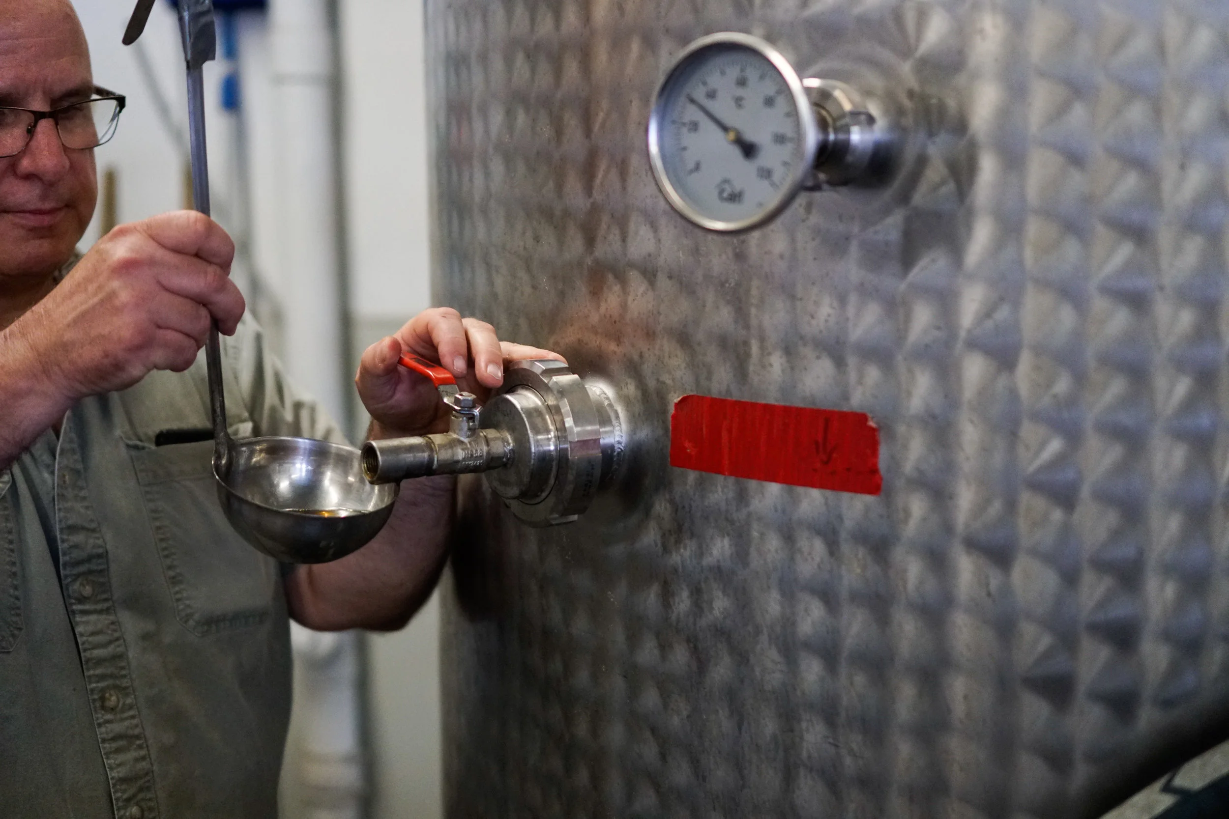 Herman Mihalich, owner of Mountain Laurel Spirits LLC, makers of Dad's Hat Pennsylvania Rye Whiskey, samples some of the company’s bottle-ready whisky in their Bristol, Pennsylvania distillery on August 1, 2019. REUTERS/Jonas Ekblom