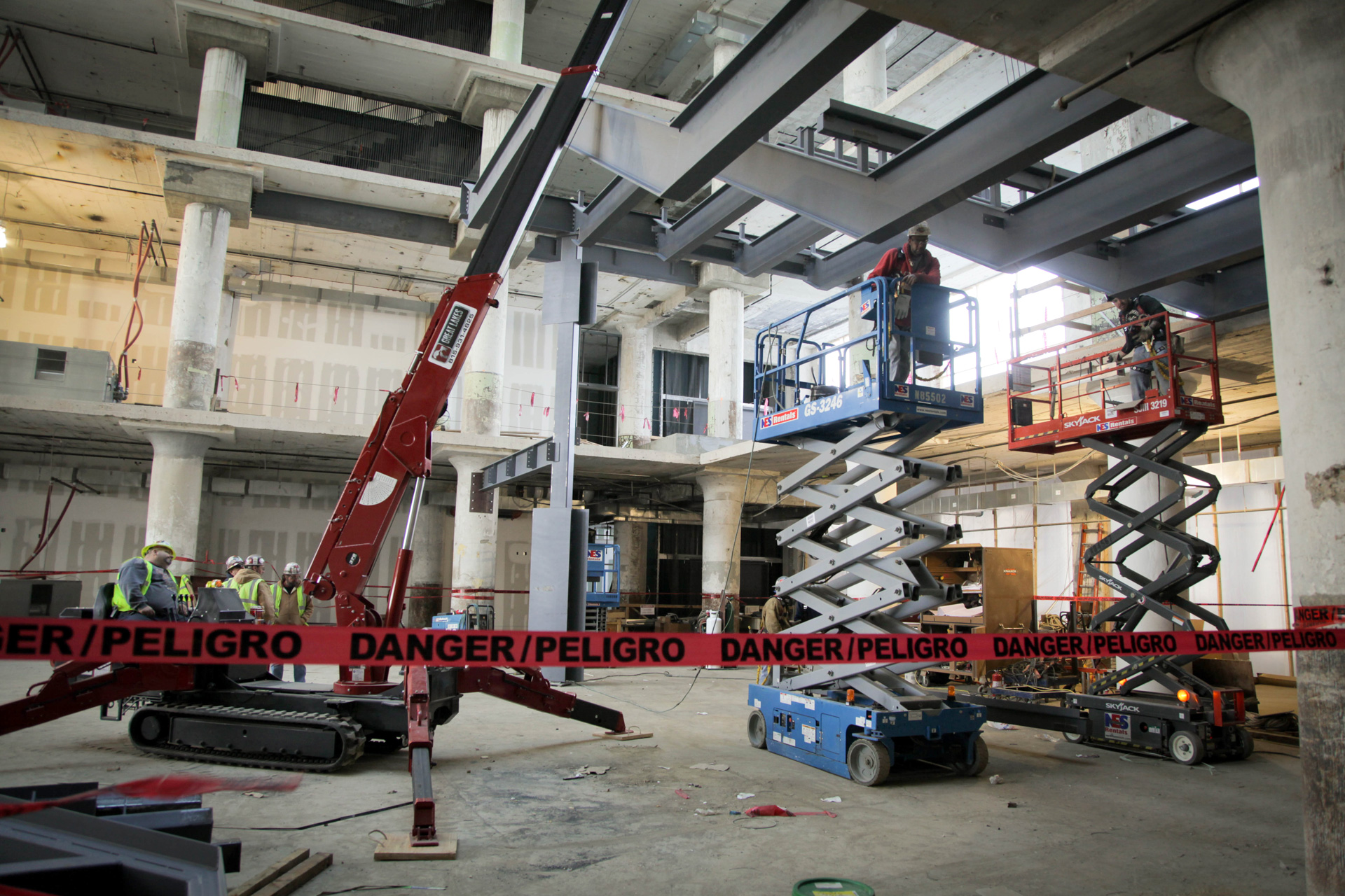 Workers constructing the Concourse Central Atrium stairs.