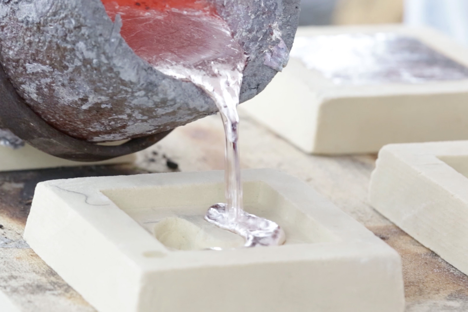 Still of the aluminum pouring from the Breaking Ground event.