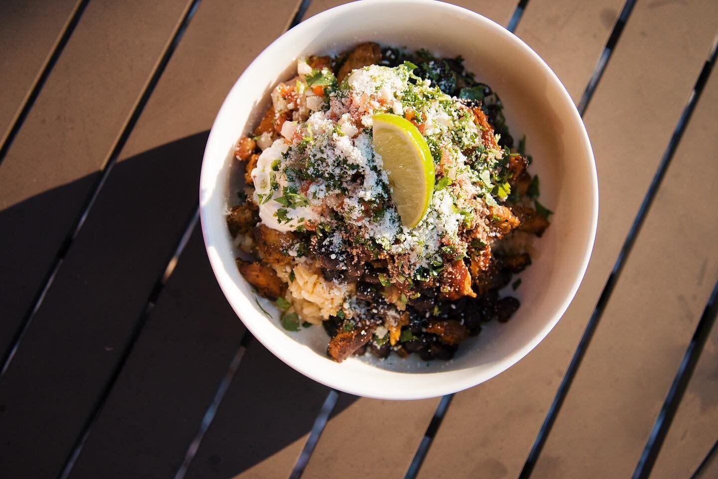 Tacos are our jam, but our rice bowls hit the spot for those looking for a full belly. Our Red Bird rice bowl is packed with ALL THE THINGS: guac, sour cream, rojo chicken, black beans, rice and cheese. Keep things spicy, baby, and splash some @elyuc