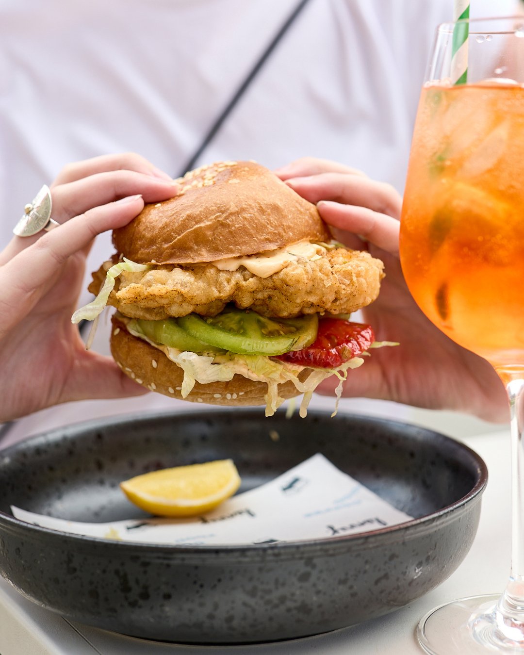 We&rsquo;re giving the Filet-O-Fish a run for its money over here! 🍔⁠
⁠
Our Fish Burger is pretty jacked &ndash; with crispy tempura barramundi, pickled heirloom tomato, shredded lettuce and dill lime sauce on a brioche bun. Add chips on the side or