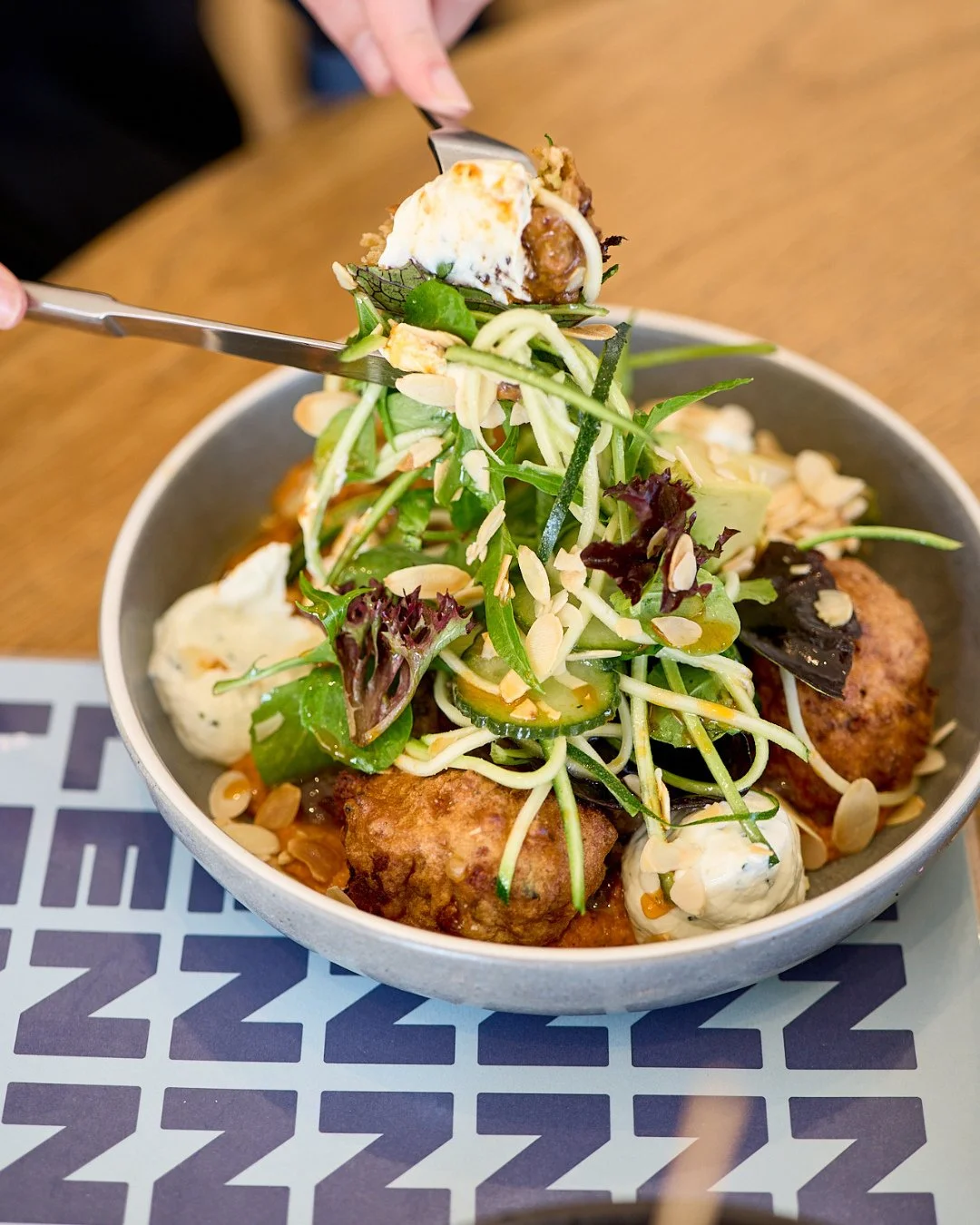Your cravings called &ndash; our Beef Rib Fritters are here to shake things up at the table! 😁 We&rsquo;ve plated up some cauliflower, zucchini and haloumi fritters, braised short rib, avocado, labneh, muhammara capsicum dip, pickled cucumber, almon