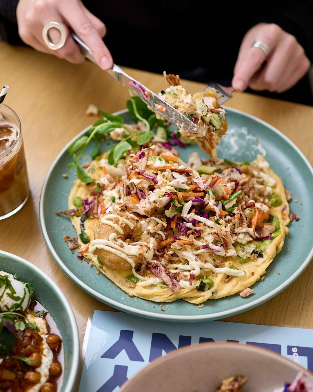 🍤 PRAWN OMELETTE 🍤⁠
⁠
Crunchy tempura prawns meet zesty Asian slaw and a drizzle of green curry mayo, while fried shallots and coriander seal the deal. (Toast optional, but highly recommended.) 😉