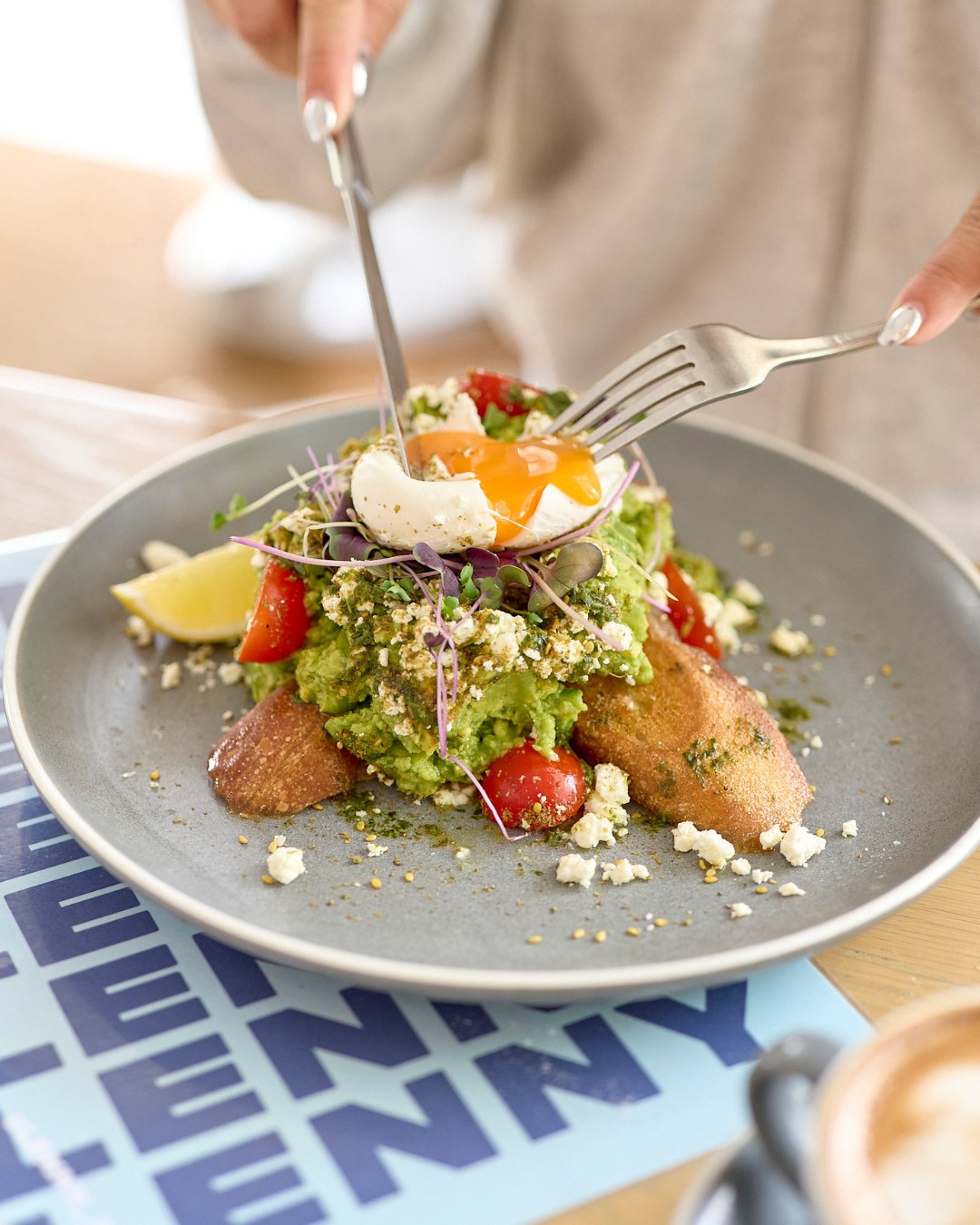 Smashed avo, but make it extra 🥑🔥⁠
⁠
Get stuck into creamy feta, zesty harissa pesto, juicy cherry tomatoes, za&rsquo;atar magic, and a silky poached egg on a toasted baguette. Basically, brekky goals. 🍳