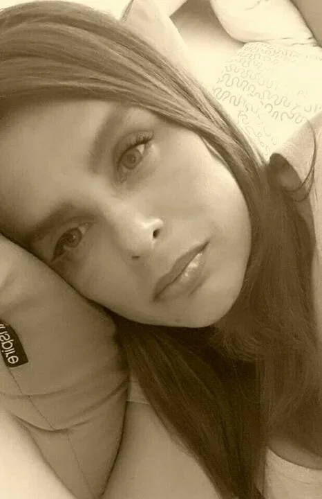 I looked long and hard for a photo of “her” with her head on a pillow.