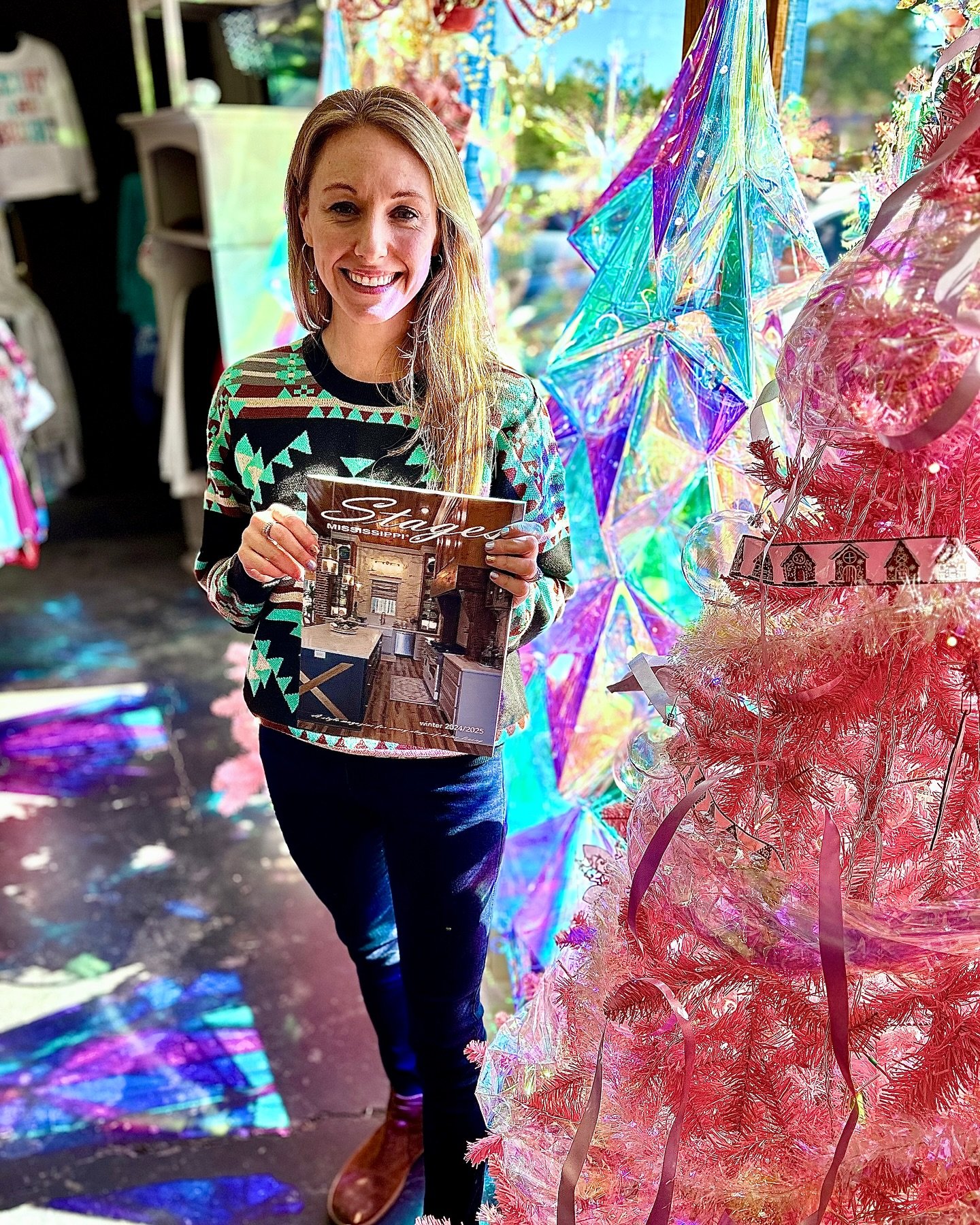 This is Alison Clark of Mississippi Hippie holding the Stages Mississippi 24/25 winter issue! 

Follow their page....so many adorable things and great prices!

Stages Mississippi 

#stagesms
#winter2024
#shoplocal