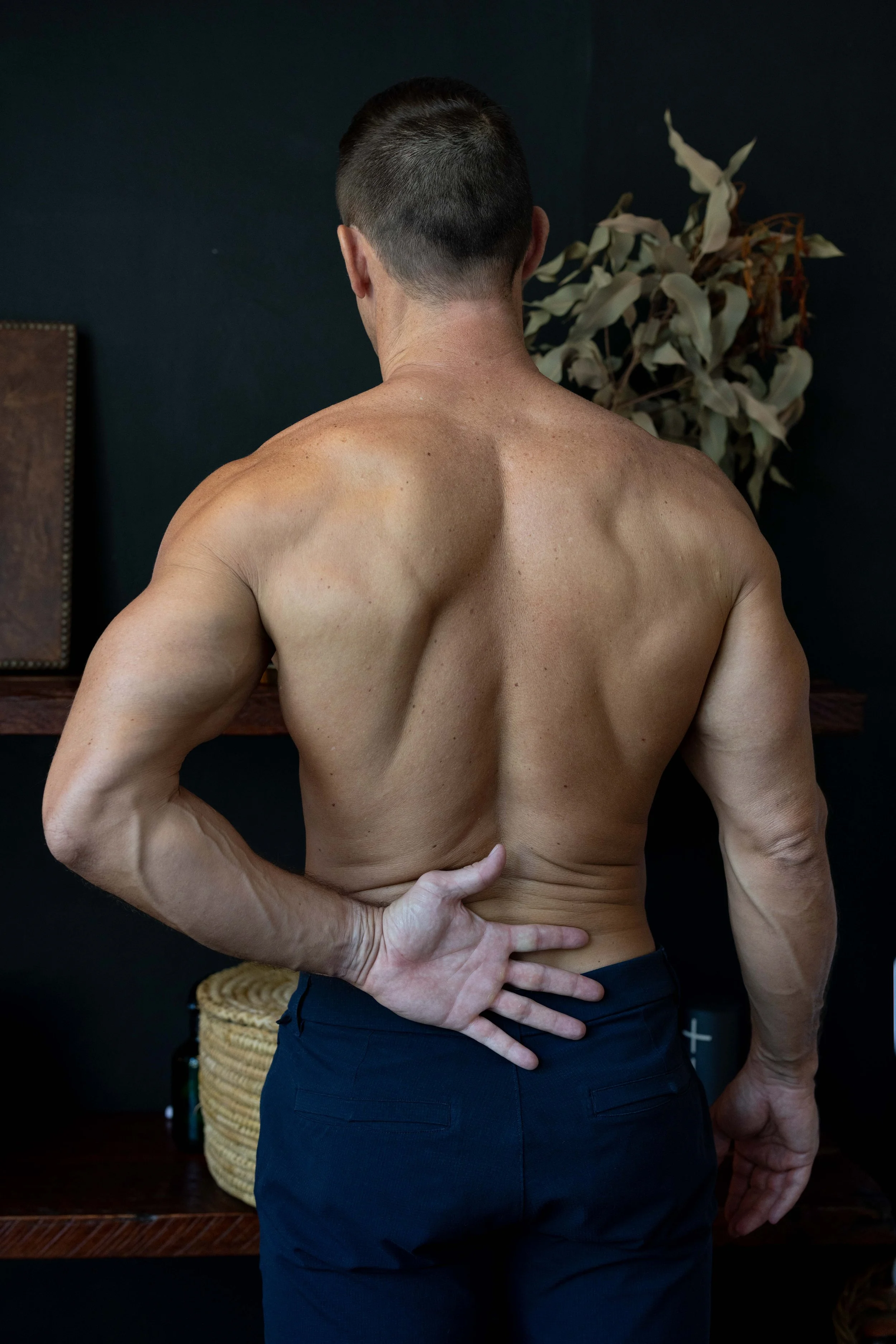 MO+ Mike Schlamp Chiropractor hand on lower back.jpg