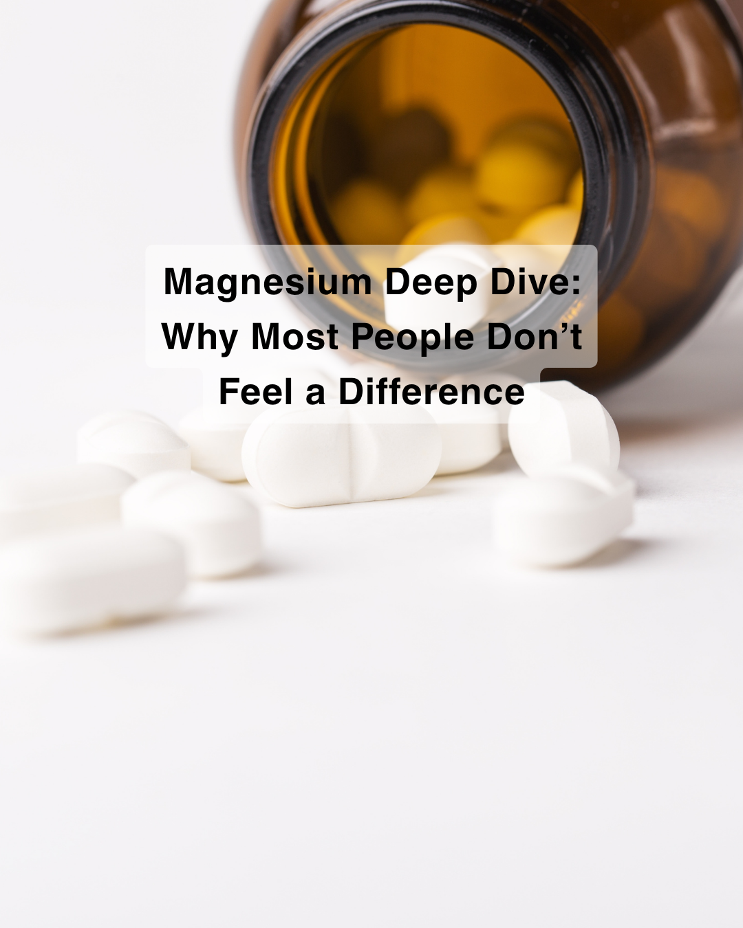 Magnesium supplement tablets spilling from an amber glass bottle with soft neutral background, representing supplementation and recovery