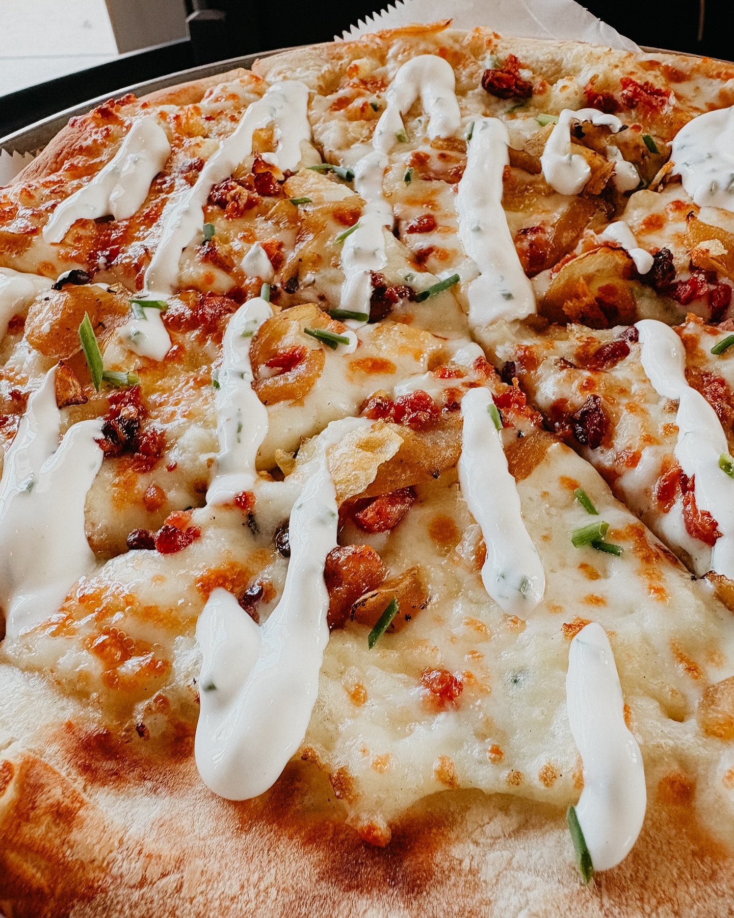 Have you tried April’s pizza of the month yet??
Meet the “Polish Hill”
Sour cream and chive potatoes, carmelized onions, crispy bacon, 2 kinds of cheeses, chive sour cream drizzle finish. 🥹😍🍕👏🏽
