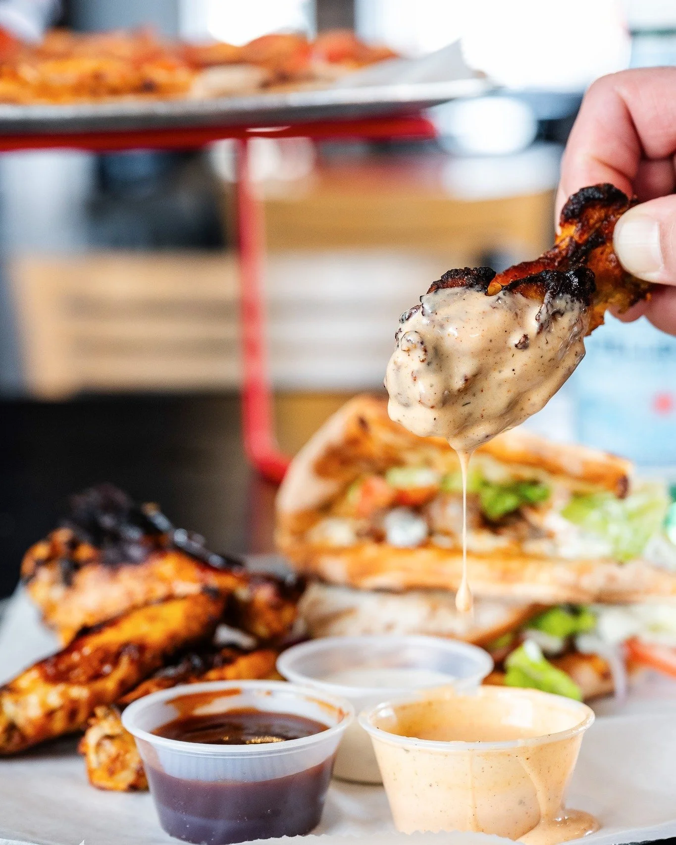 I think this photo speaks for itself. Come on in for a folded sandwich and wings!